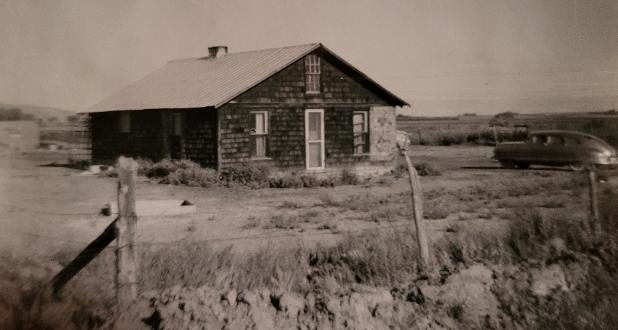 The original railroad-tie house at Loma with its tin roof