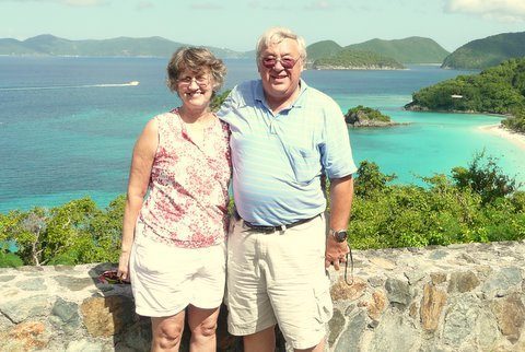 Ron and Bonny above a turquoise bay