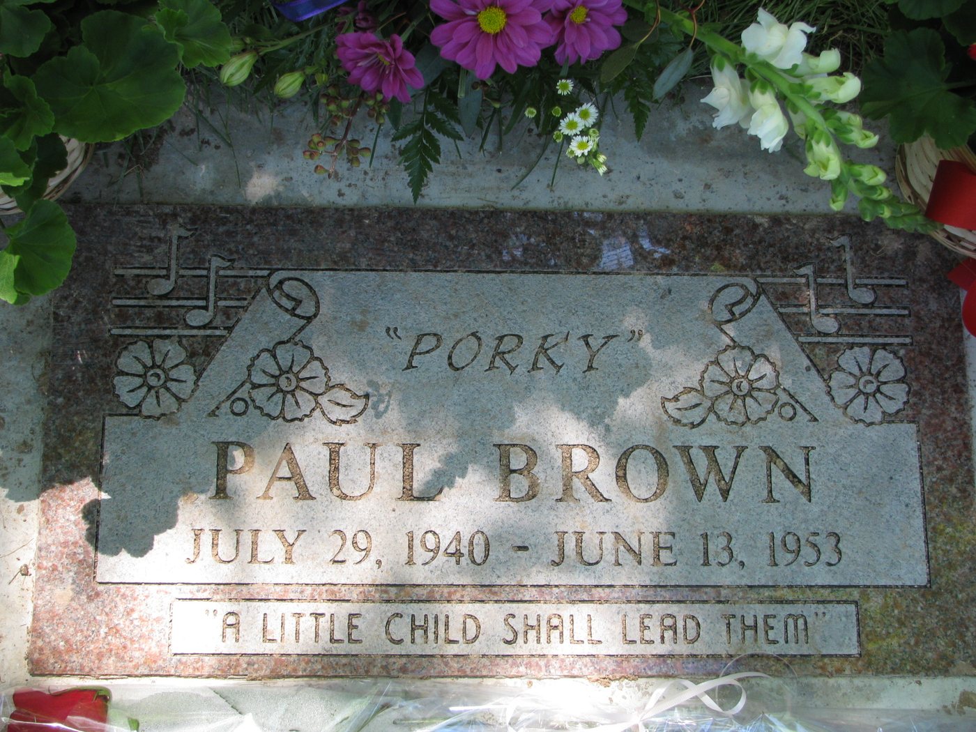 The grave marker: 'PORKY' PAUL BROWN, JULY 29, 1940 – JUNE 13, 1953 — A LITTLE CHILD SHALL LEAD THEM