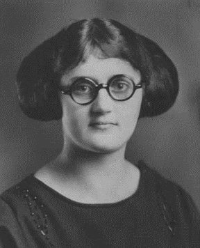 A young woman in round glasses, 1920s portrait