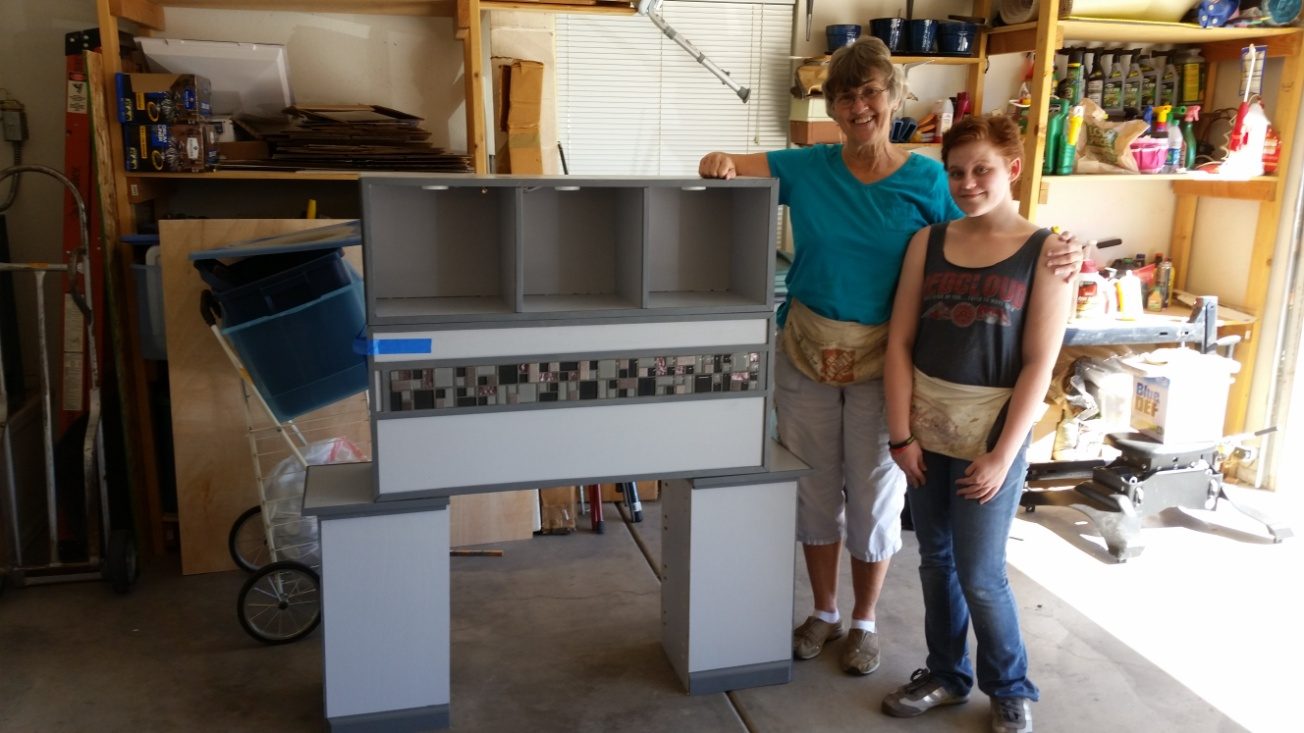 The same bed unit, wider view of the workshop with tool board and drill press behind