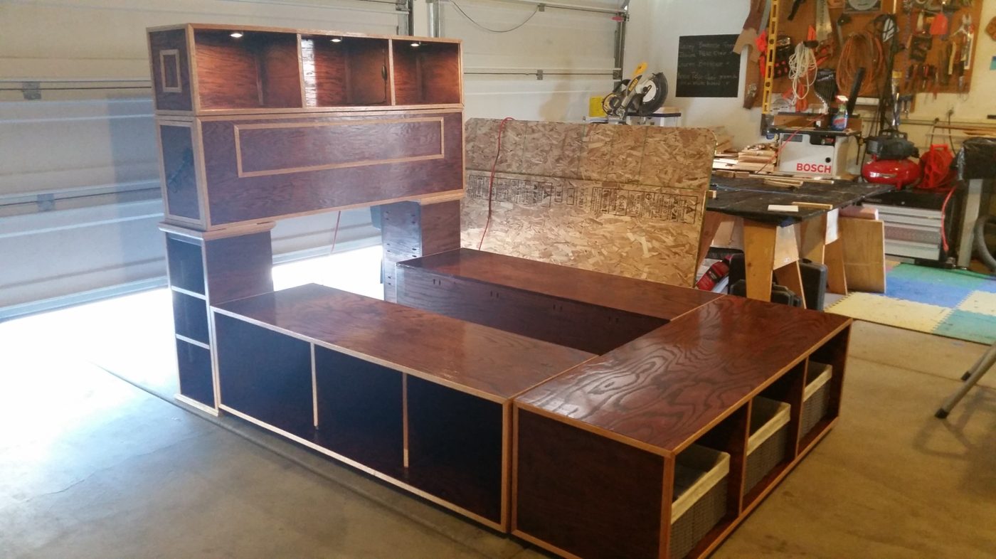 The modular queen bed platform and headboard unit in the garage