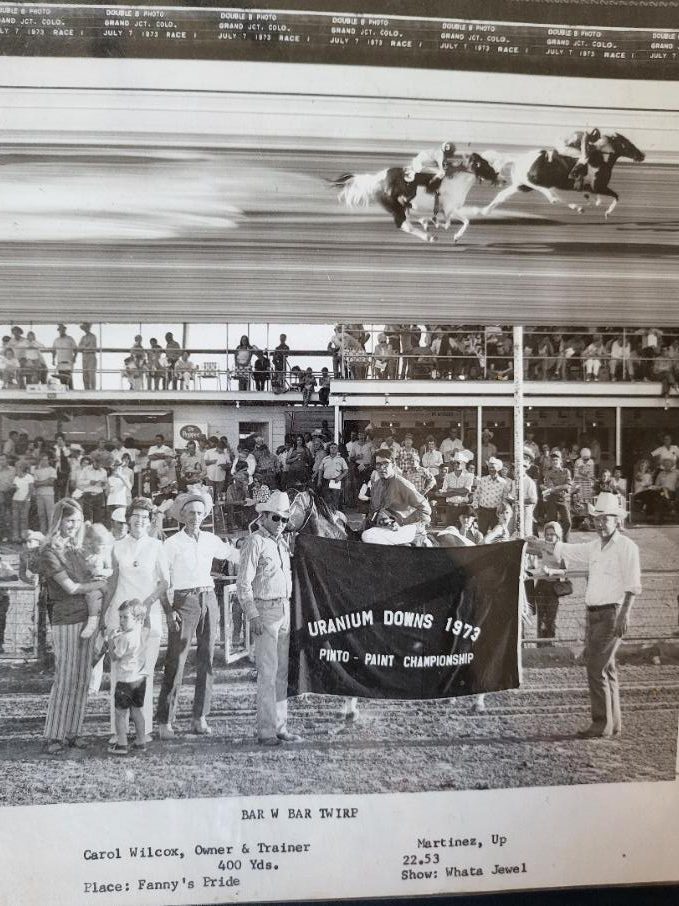 Twirp in the winner's circle with banner